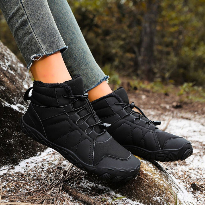 Chaussures neige imperméables unisexe, design pieds nus, antidérapantes pour un hiver rigoureux et confortable.