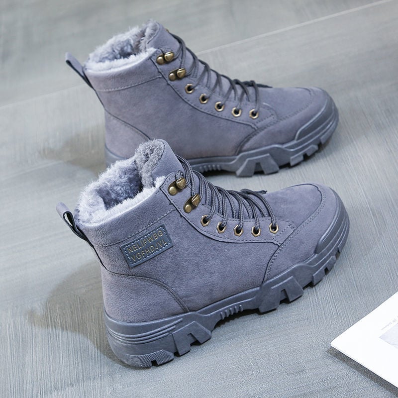 Bottes femme style urbain moderne, idéales automne-hiver, avec semelle épaisse et lacets pour un look élégant.