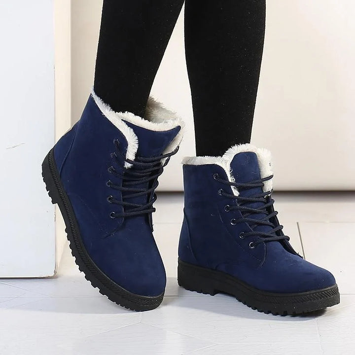 Bottines en daim noir pour femmes, imperméables et chaudes, parfaites pour affronter le froid de l'hiver.