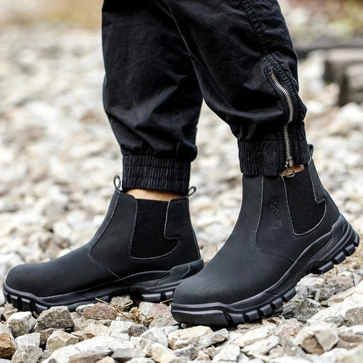 Bottines Chelsea sécurité montantes noires hommes/femmes. Idéales travail, chantier, protection pieds.