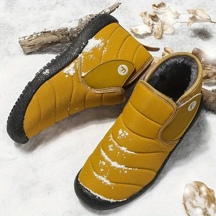 Texture du revêtement extérieur imperméable des bottines d'hiver pour hommes et femmes.