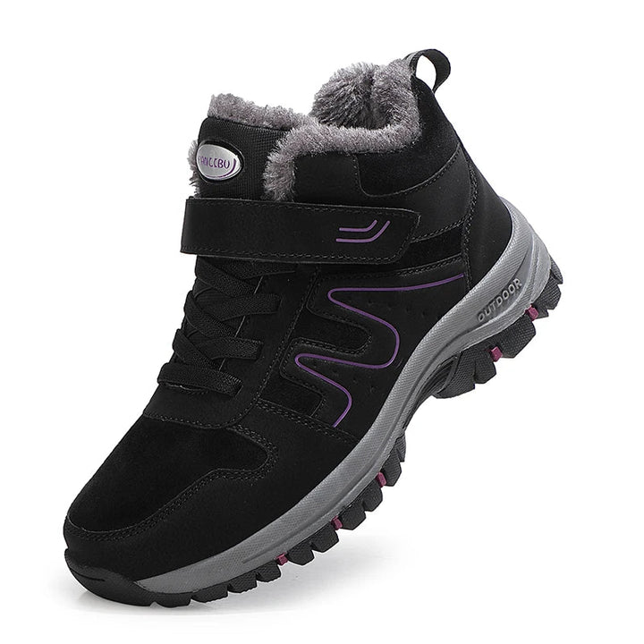 Vue latérale des bottines imperméables femme, confortables et prêtes pour la neige.