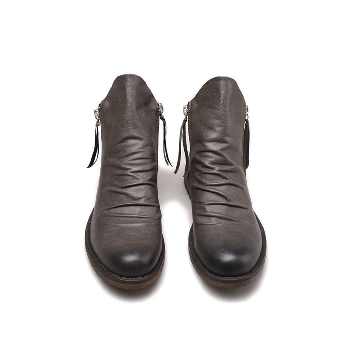 Bottines montantes homme élégantes à la cheville, avec zip pour confort, style urbain mode masculine.