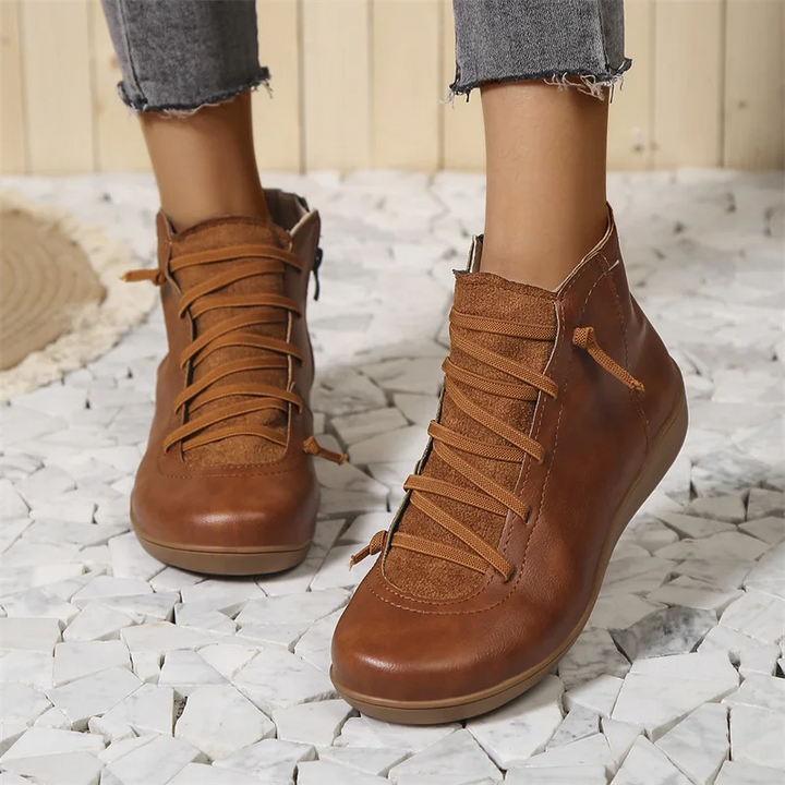 Bottines orthopédiques imperméables lacées pour femme, offrant confort et maintien optimal aux pieds.