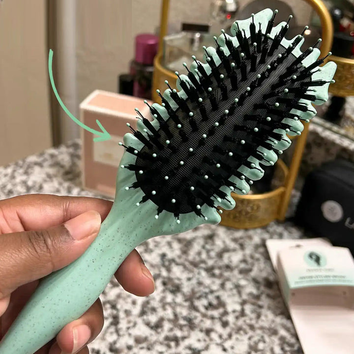 Brosse démêlante pour cheveux bouclés et crépus. Démêle en douceur, réduit frisottis, picots souples.