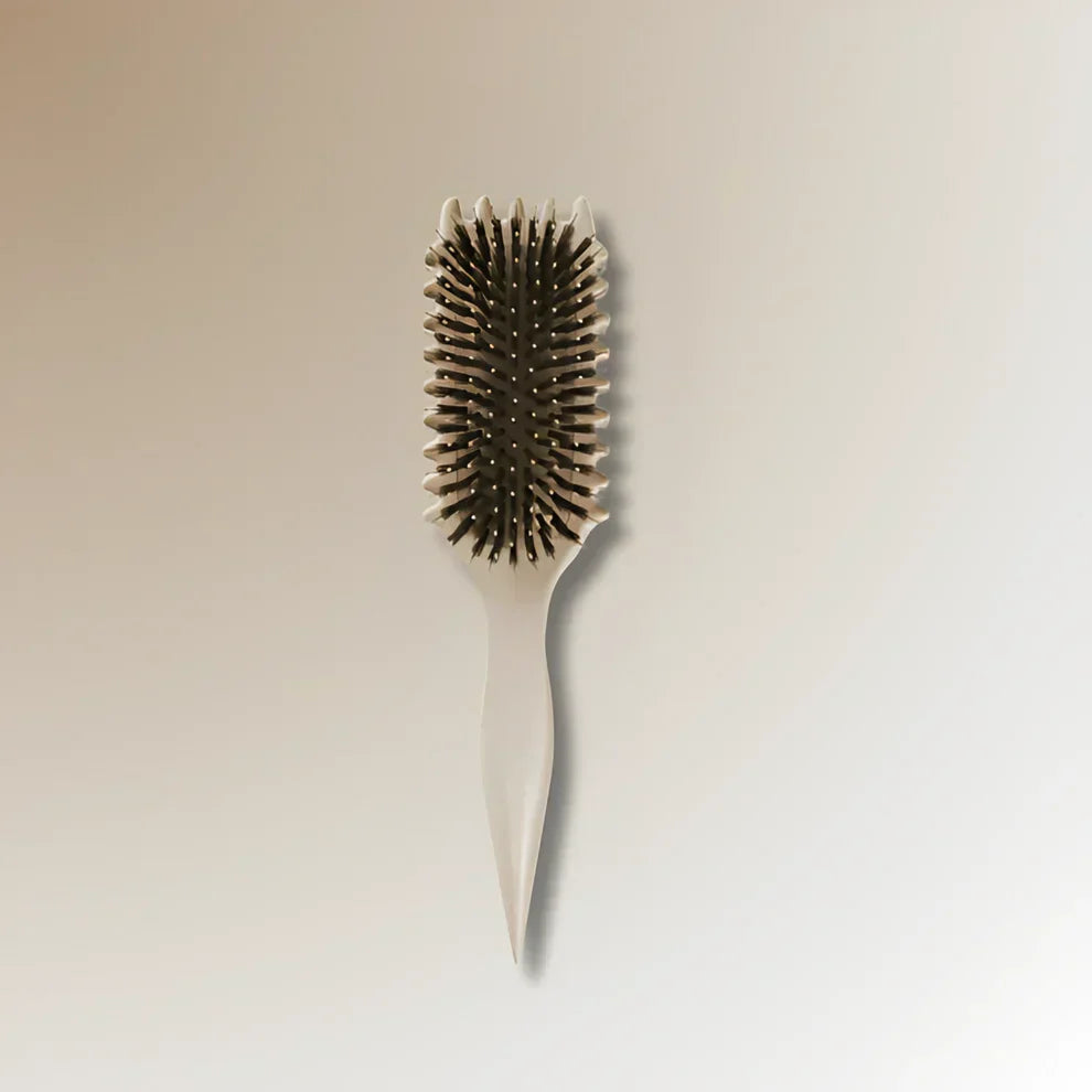 Brosse démêlante pour cheveux bouclés et crépus. Démêle en douceur, réduit frisottis, picots souples.