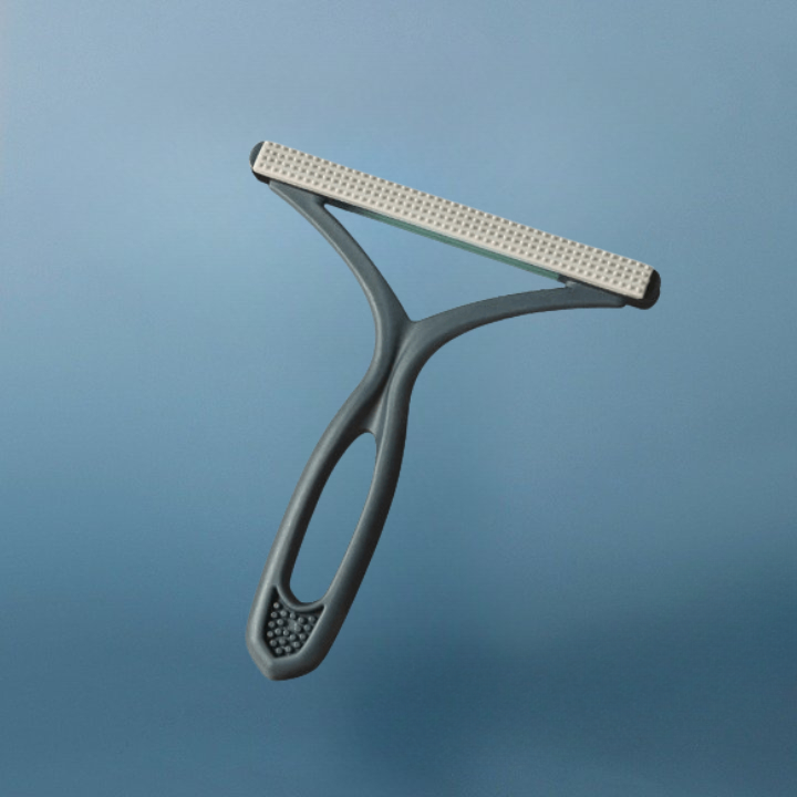 Brosse double face anti-poils chien.  Efficace sur meubles, vêtements et sols.  Ergonomique.