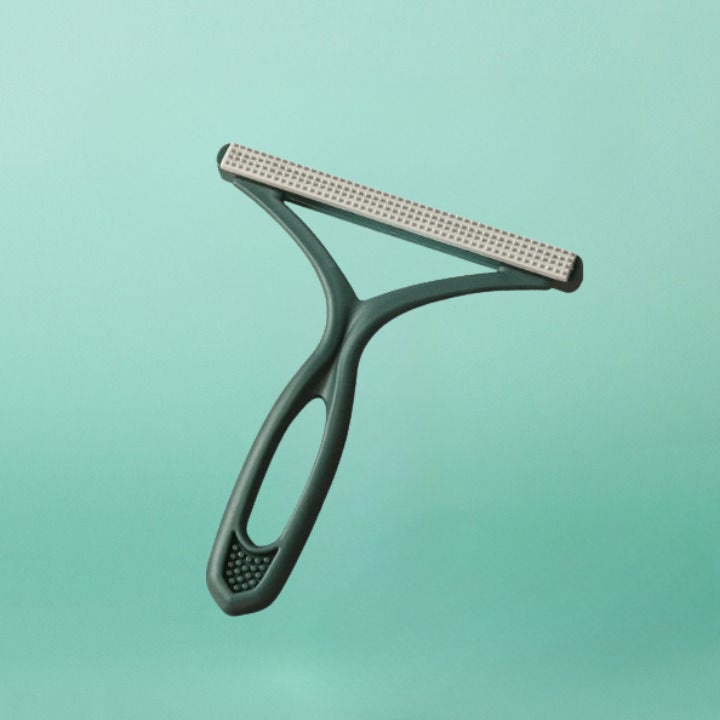 Brosse double face anti-poils chien.  Efficace sur meubles, vêtements et sols.  Ergonomique.