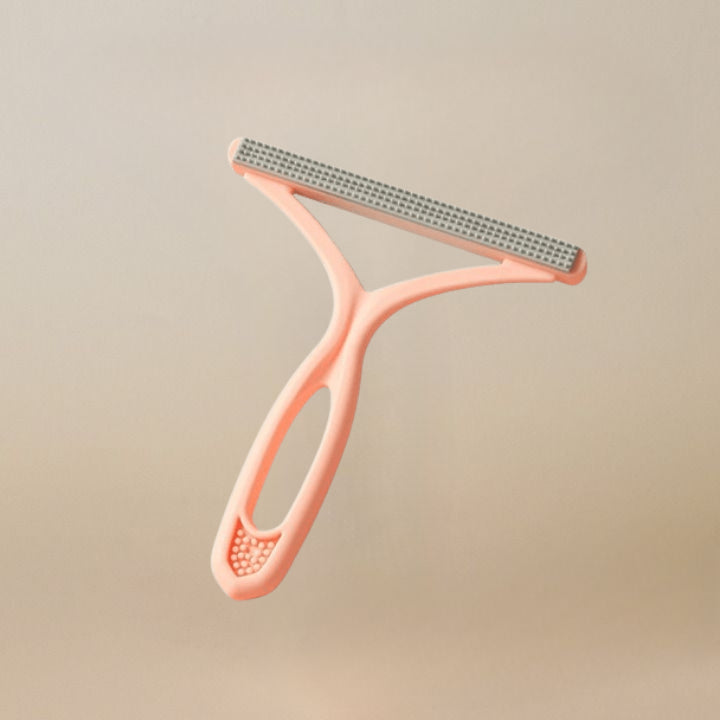 Brosse double face anti-poils chien.  Efficace sur meubles, vêtements et sols.  Ergonomique.