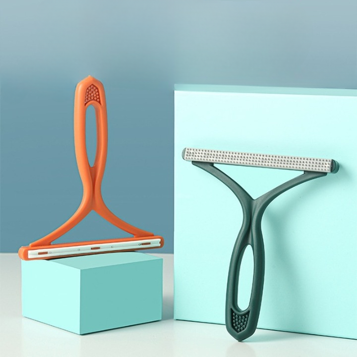 Brosse double face anti-poils chien.  Efficace sur meubles, vêtements et sols.  Ergonomique.