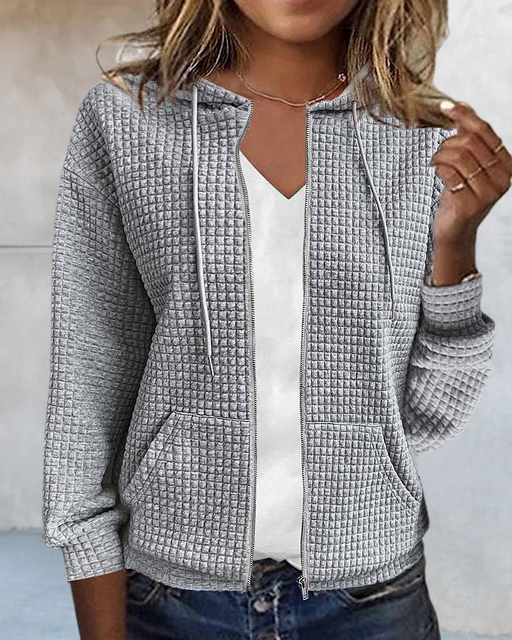 Cardigan femme doux et confortable, poches, coupe décontractée.