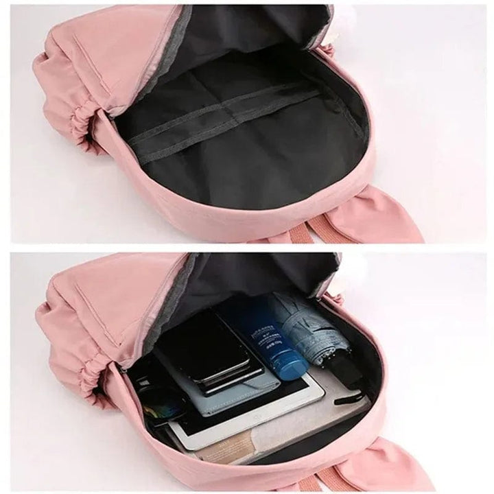 Cartable enfant, design mignon, compartiments multiples, porte-clés inclus. Idéal rentrée scolaire.
