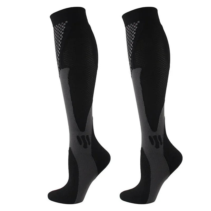Chaussettes de compression noires et grises, renforcées, pour confort et circulation optimale, idéales sport et daily use.