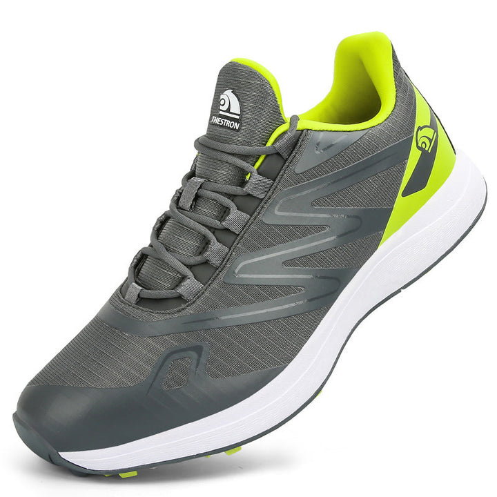 "Chaussures de golf homme légères et adhérentes, vue de côté, avec semelle crantée pour traction optimale sur gazon."