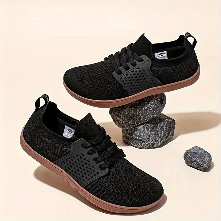 Chaussures homme de marche larges et confortables, design minimaliste, bien-être athlétique.