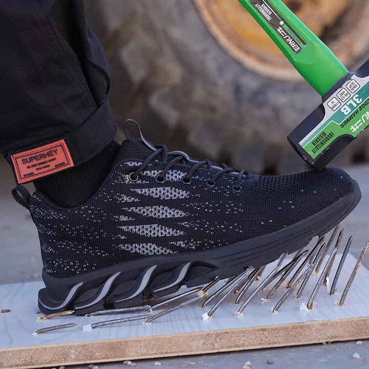 Chaussures de sécurité légères unisexes noires avec embout en acier, idéales pour le travail et la protection.