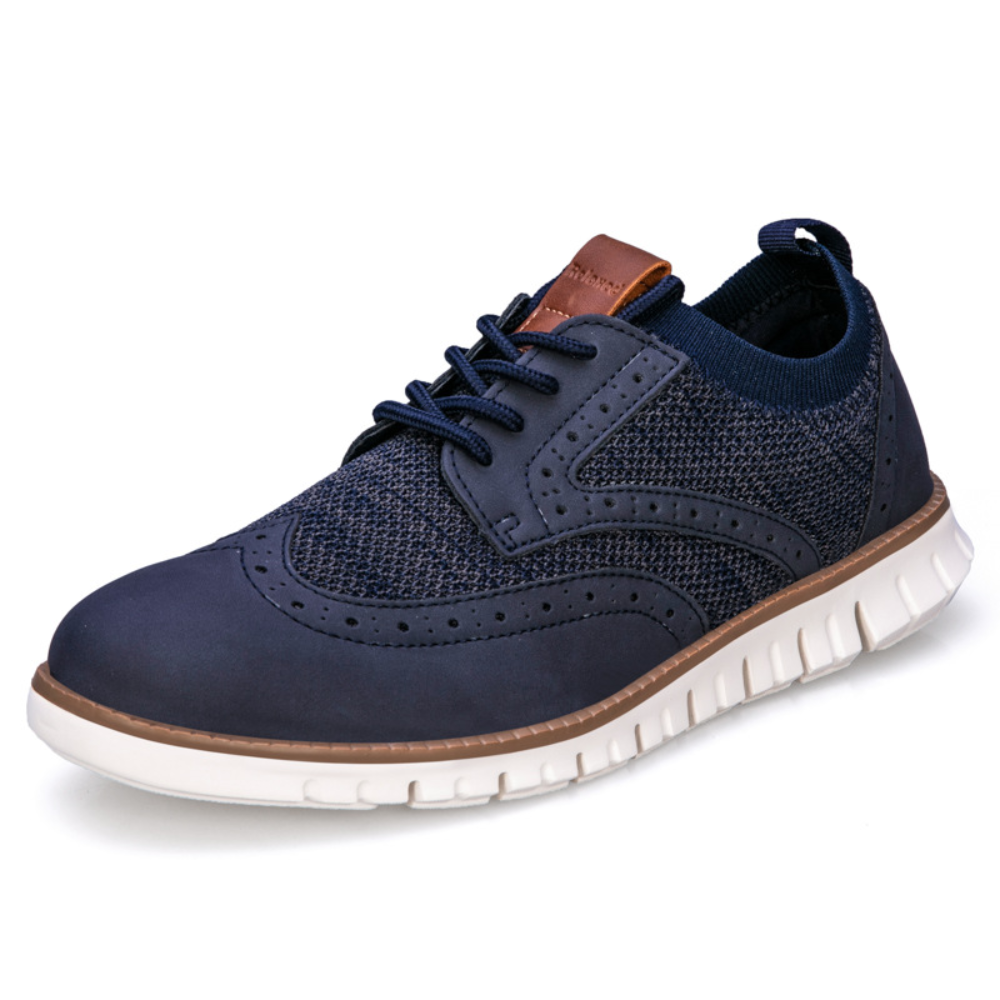"Chaussures élégantes en cuir synthétique bleu foncé pour hommes, respirantes et au design moderne."