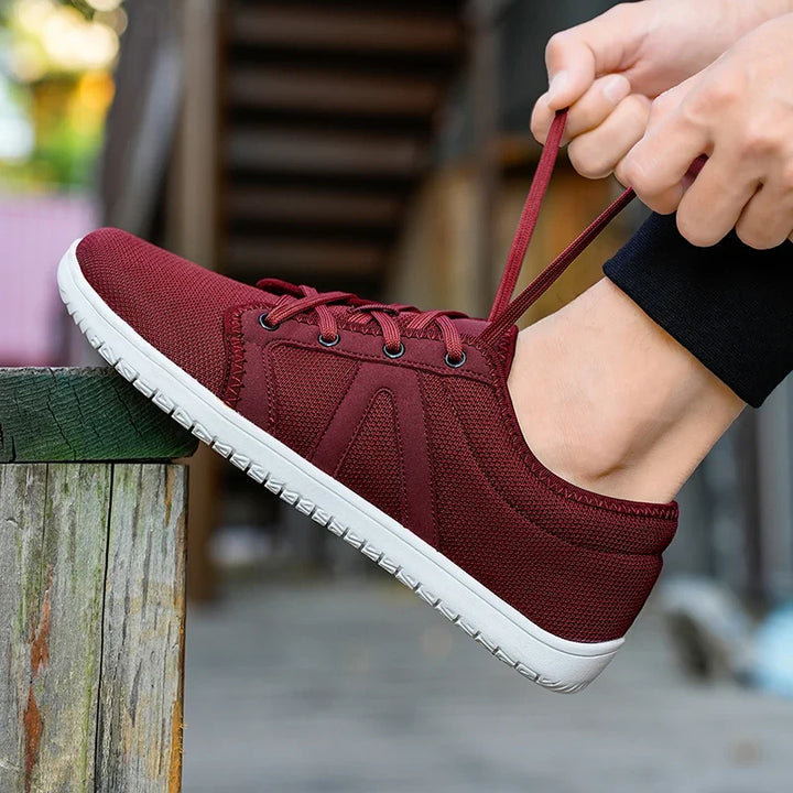 Chaussures minimalistes homme/femme pour pieds larges, conçues pour marche et course avec légèreté et flexibilité.