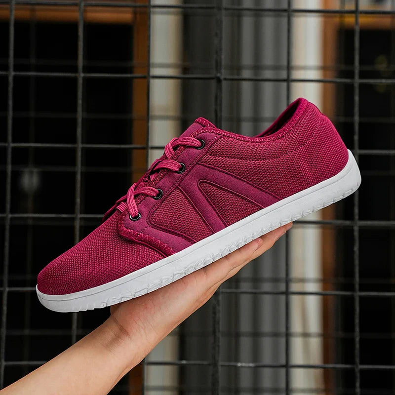 Paire de chaussures minimalistes unisexes pour la marche et la course, idéales pieds larges et légères.