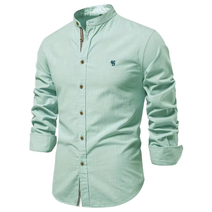 Chemise col Mao coton, élégante et moderne. Coupe ajustée,  détails soignés.  Parfait pour un look chic.