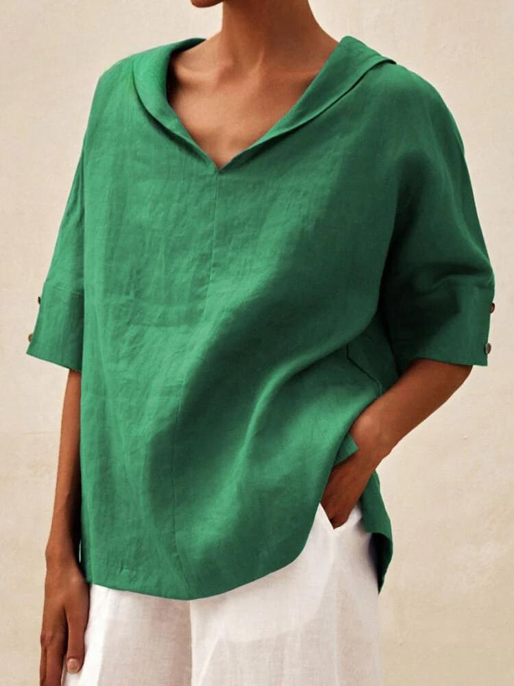 Chemise femme col V, coupe décontractée et élégante.  Tissu fluide et confortable.