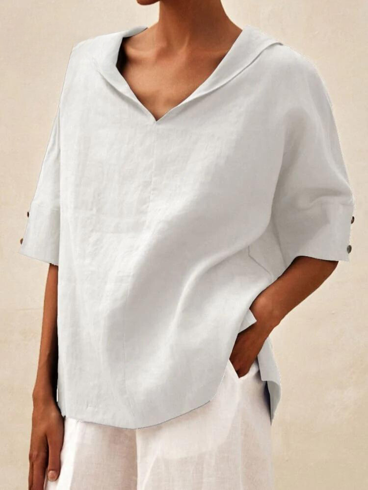 Chemise femme col V, coupe décontractée et élégante.  Tissu fluide et confortable.