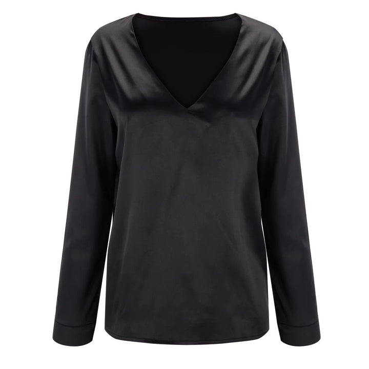 Top femme élégant à col V profond, fluide, idéal pour une soirée ou un look sophistiqué.