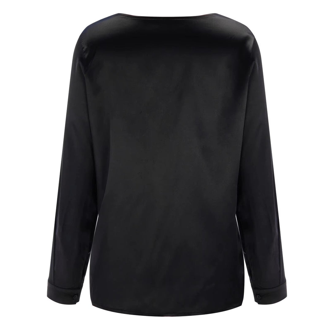 Chemise fluide femme, col V profond, manches longues, parfaite pour un style chic et actuel.
