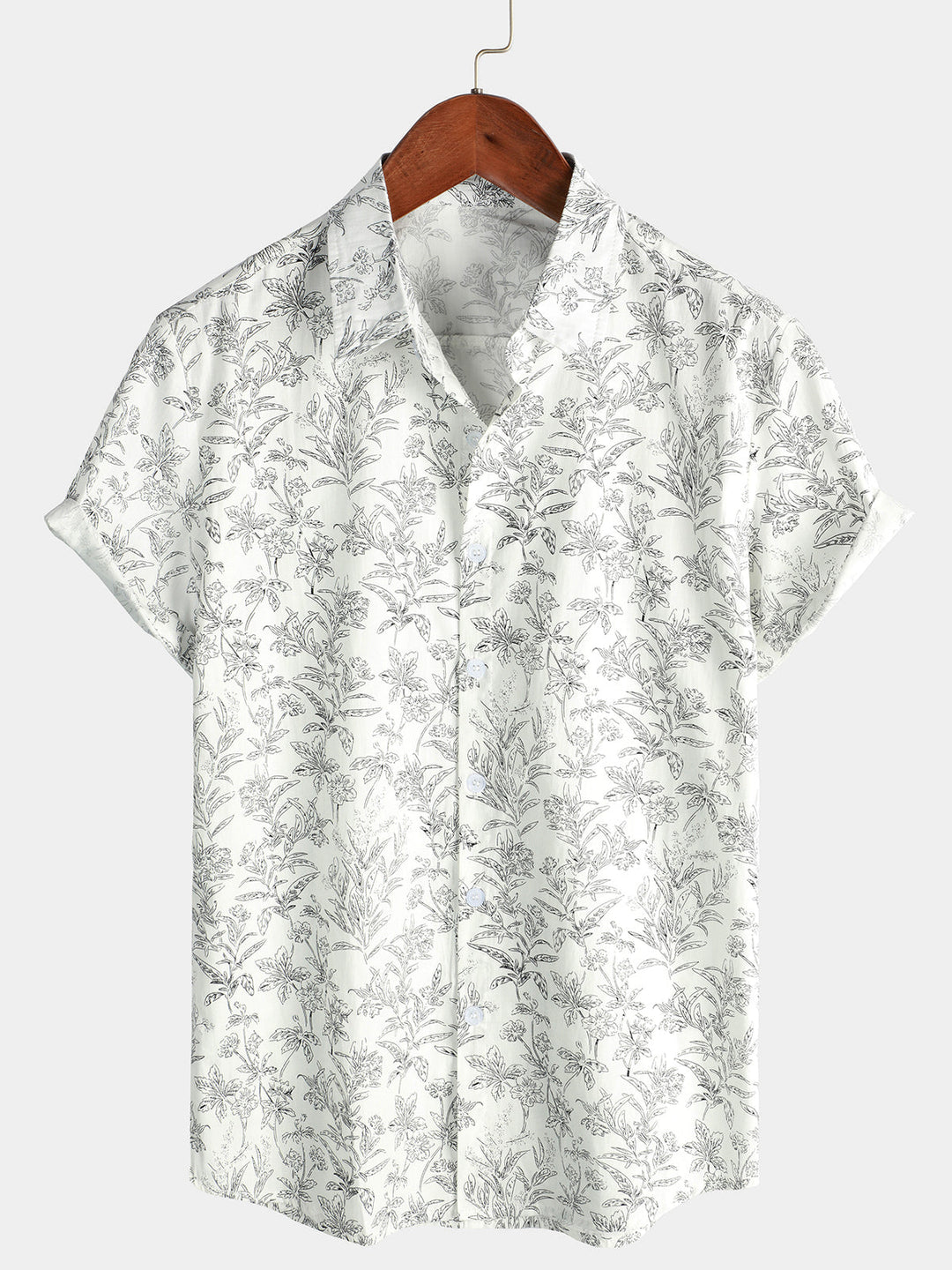 Homme portant une chemise hawaïenne à manches courtes, décontractée, imprimé tropical pour l'été.