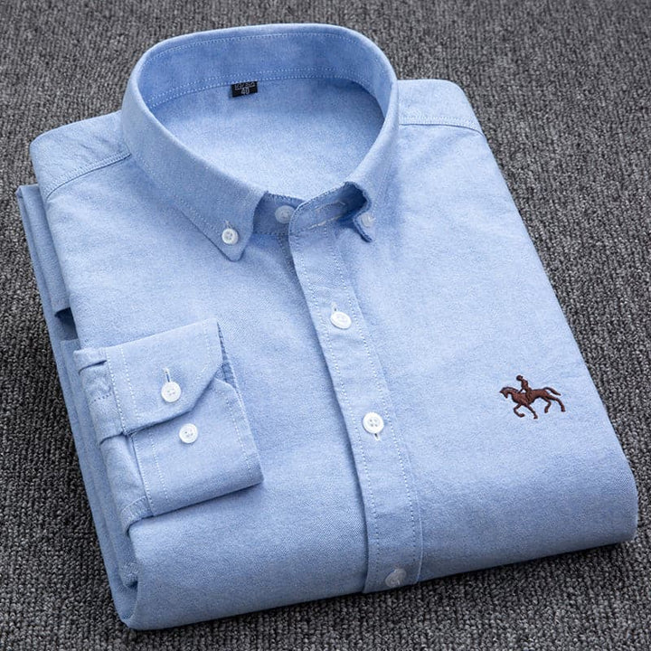 "Chemise homme élégante blanche, bleu, rose, turquoise, design chic, tissu respirant, idéale pour toute occasion."