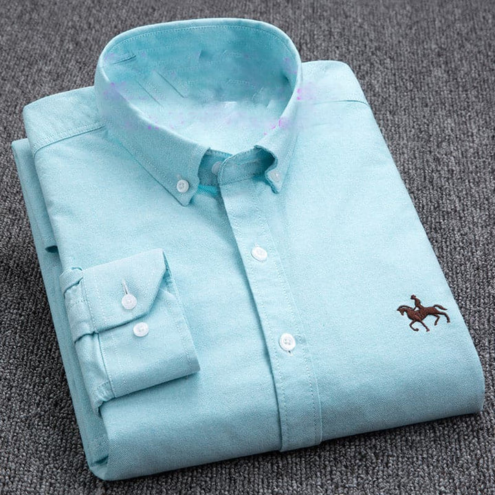 "Chemise homme élégante blanche, bleu, rose, turquoise, design chic, tissu respirant, idéale pour toute occasion."