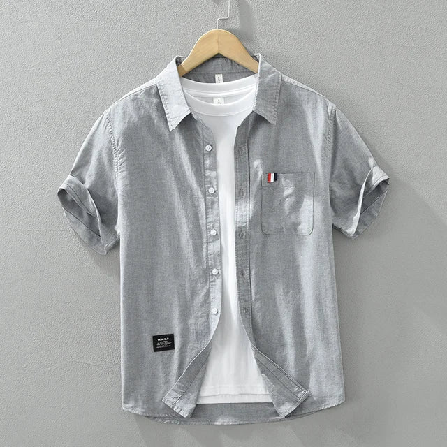 Chemise homme en coton, manches courtes, élégante, coupe moderne, couleur noir, bleu, gris ou blanc, style polyvalent.