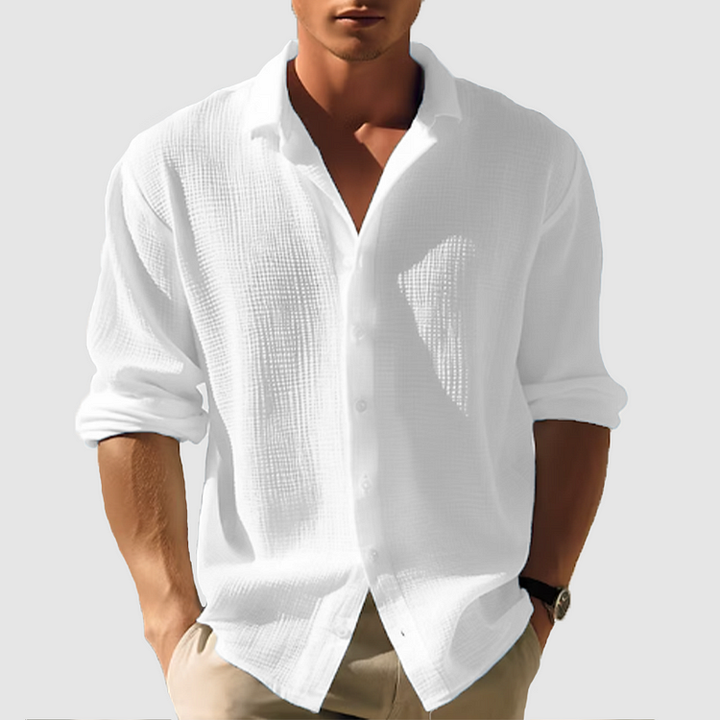 Chemise homme manches longues, élégante et boutonnée. Coupe ajustée, tissu doux.