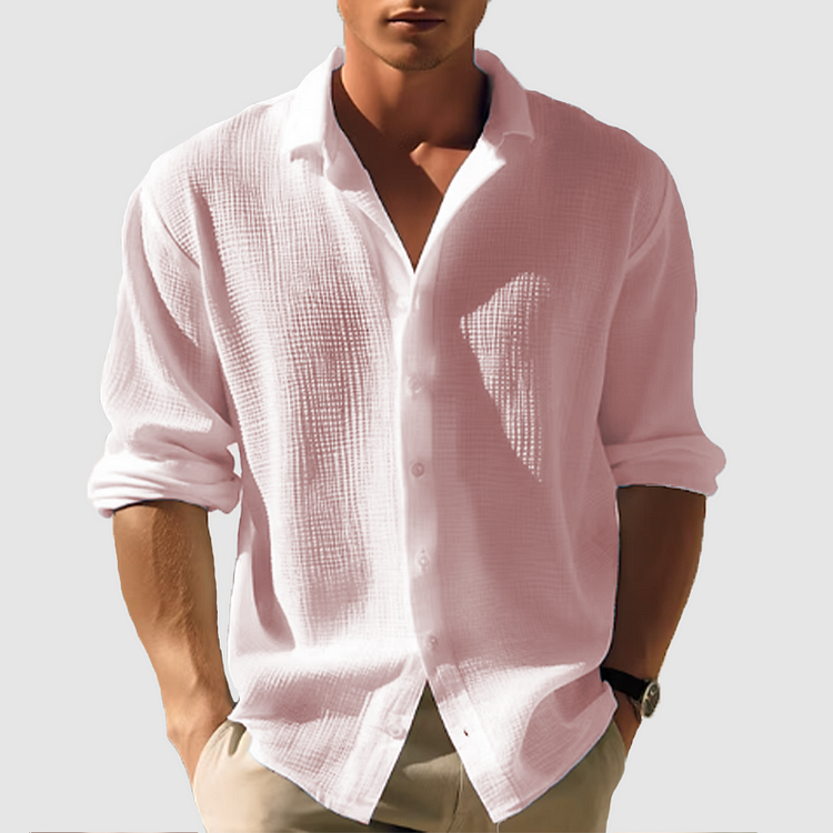Chemise homme manches longues, élégante et boutonnée. Coupe ajustée, tissu doux.
