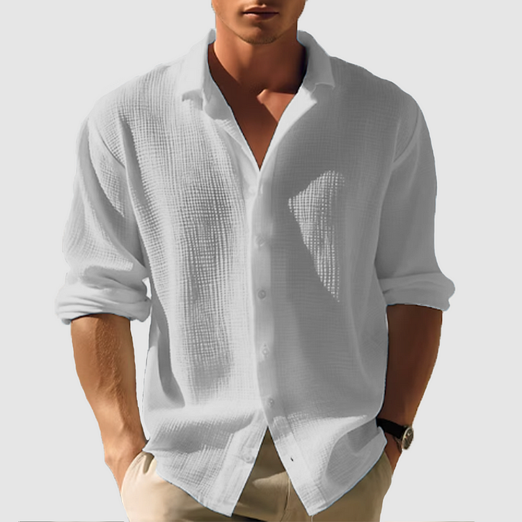 Chemise homme manches longues, élégante et boutonnée. Coupe ajustée, tissu doux.