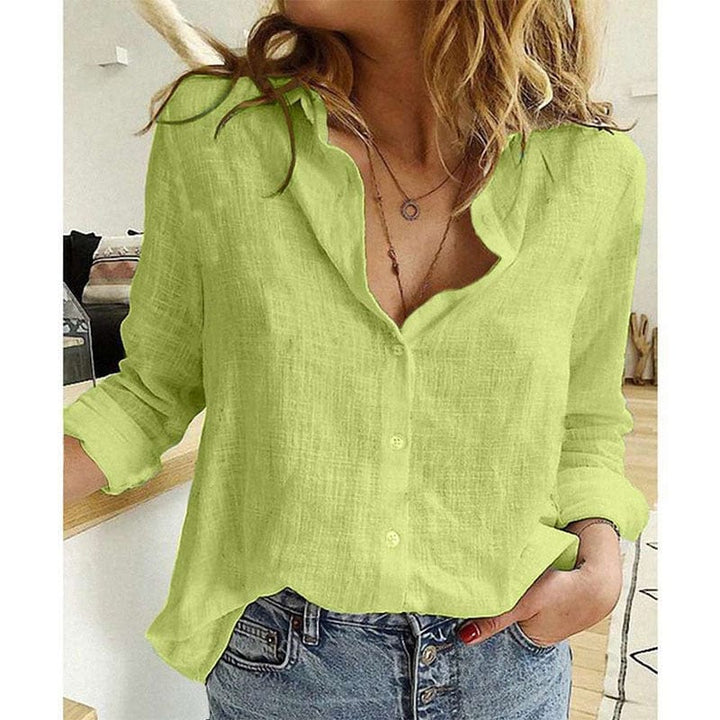 Chemise élégante femme, couleur unie, col et manches longues, parfaite pour compléter toute garde-robe chic.