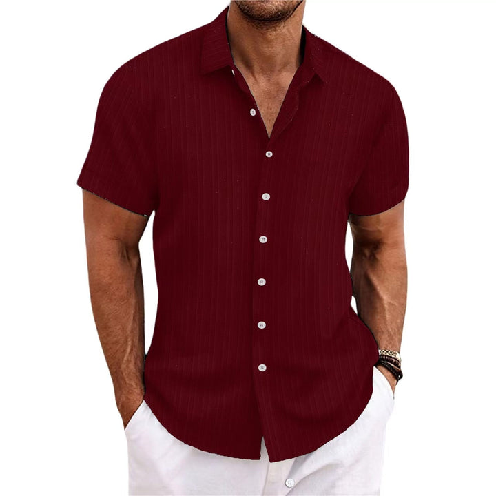 Chemise rayée homme en coton et lin, élégante et intemporelle, parfaite pour un look classique et confortable.