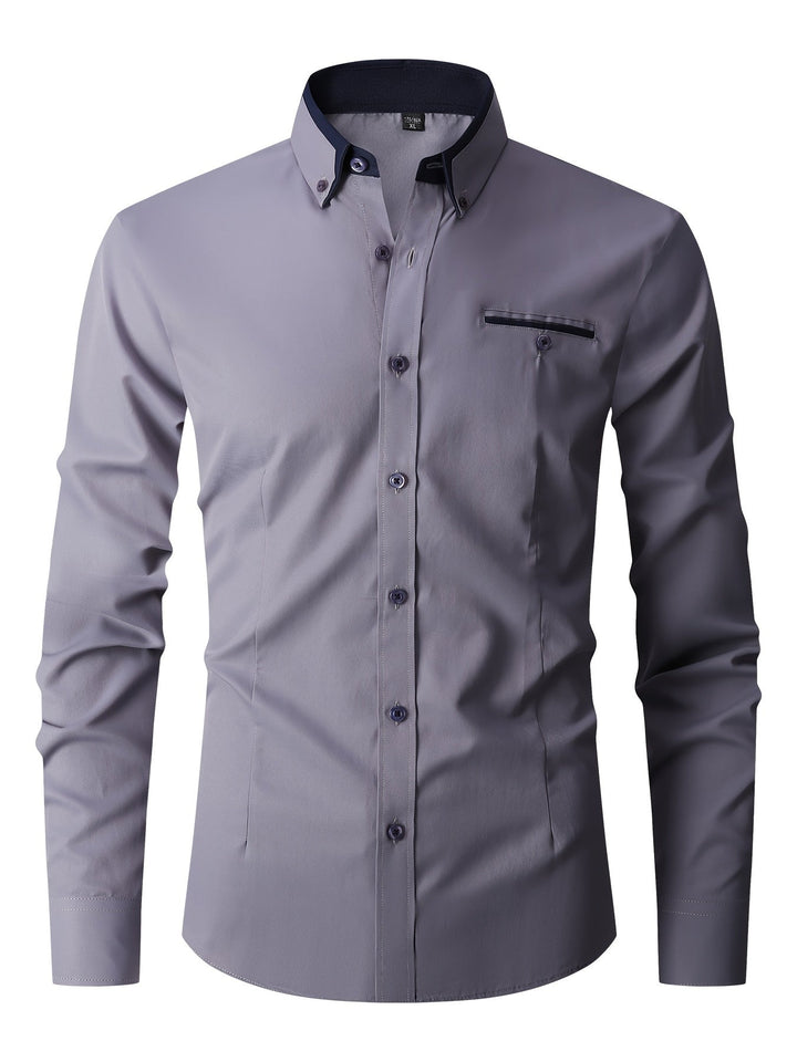 Détail: Chemise boutonnée homme, col classique, tissu stretch moderne. Confortable et élégante pour la saison automne.