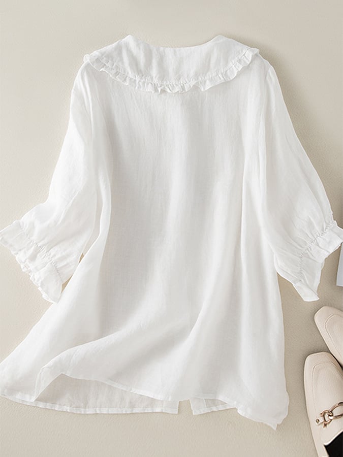 Haut femme décontracté à coupe ample, avec élégant col à volants, parfait pour la mode féminine.