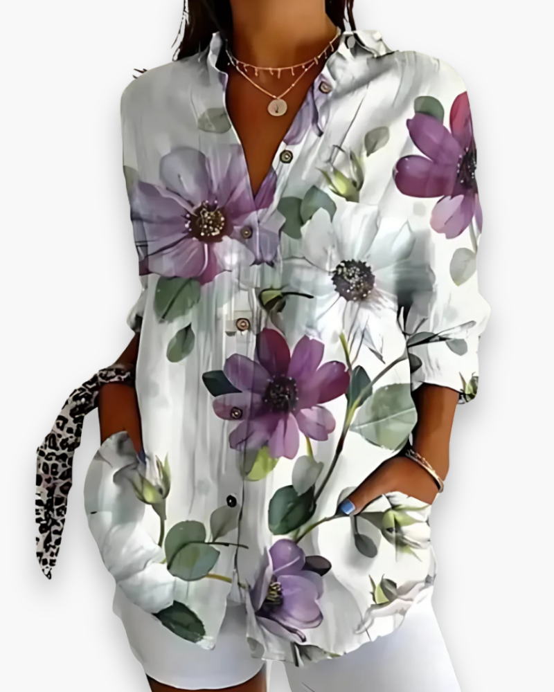 "Chemisier femme chic imprimé élégant, coupe fluide, motifs sophistiqués, idéal pour style raffiné et occasions spéciales."