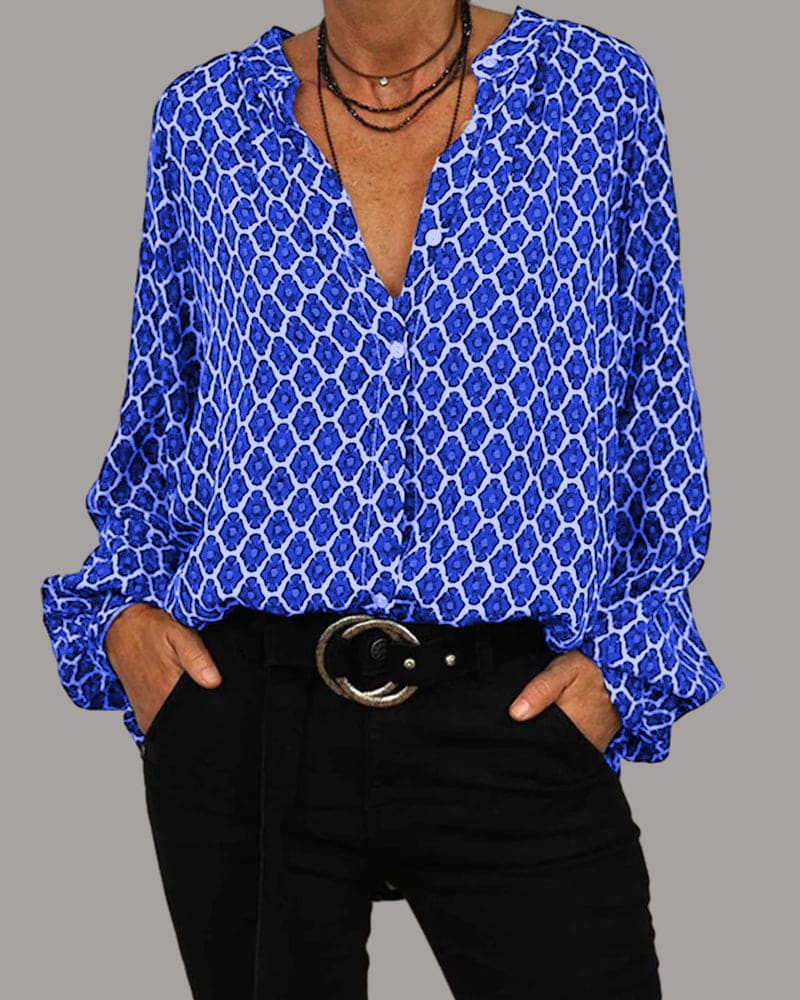 "Chemisier femme en coton, col V élégant, manches longues, motif géométrique, disponible en bleu, noir et rouge."