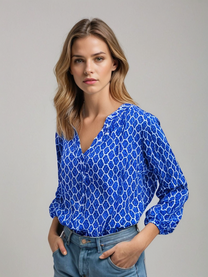 "Chemisier femme en coton, col V élégant, manches longues, motif géométrique, disponible en bleu, noir et rouge."