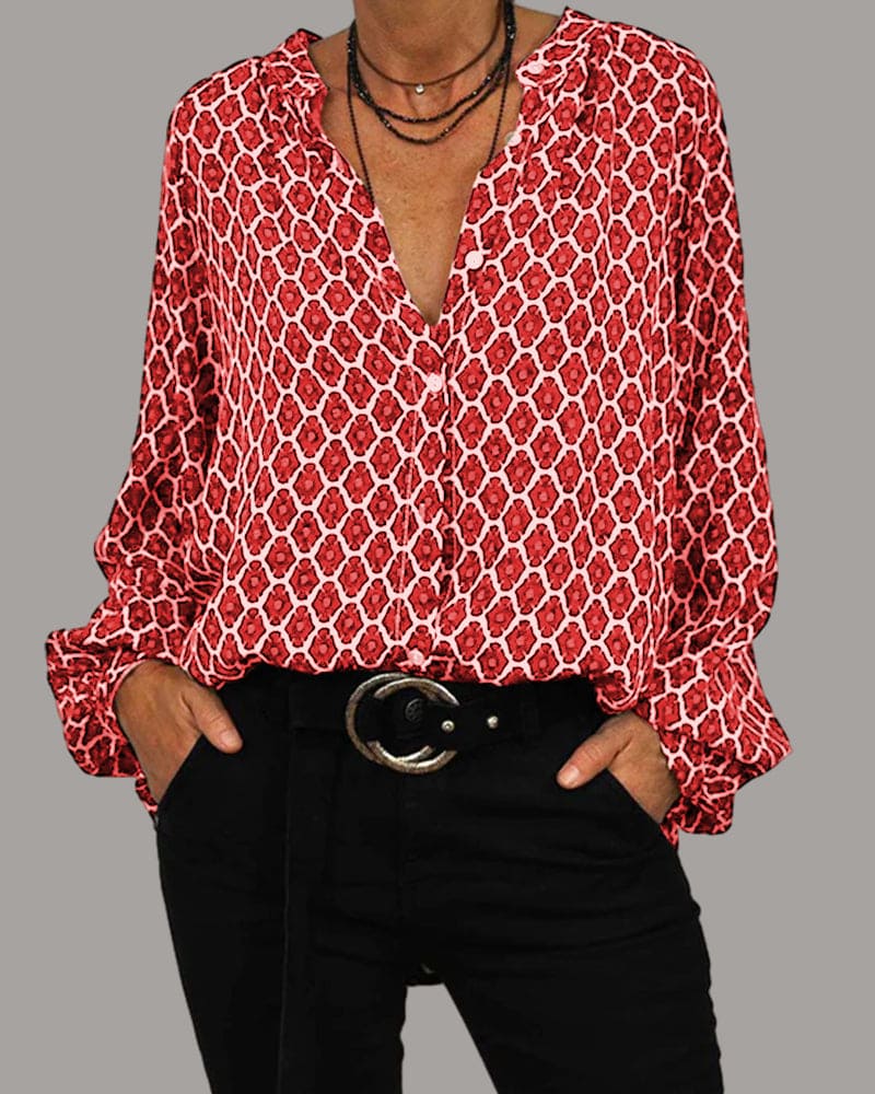"Chemisier femme en coton, col V élégant, manches longues, motif géométrique, disponible en bleu, noir et rouge."