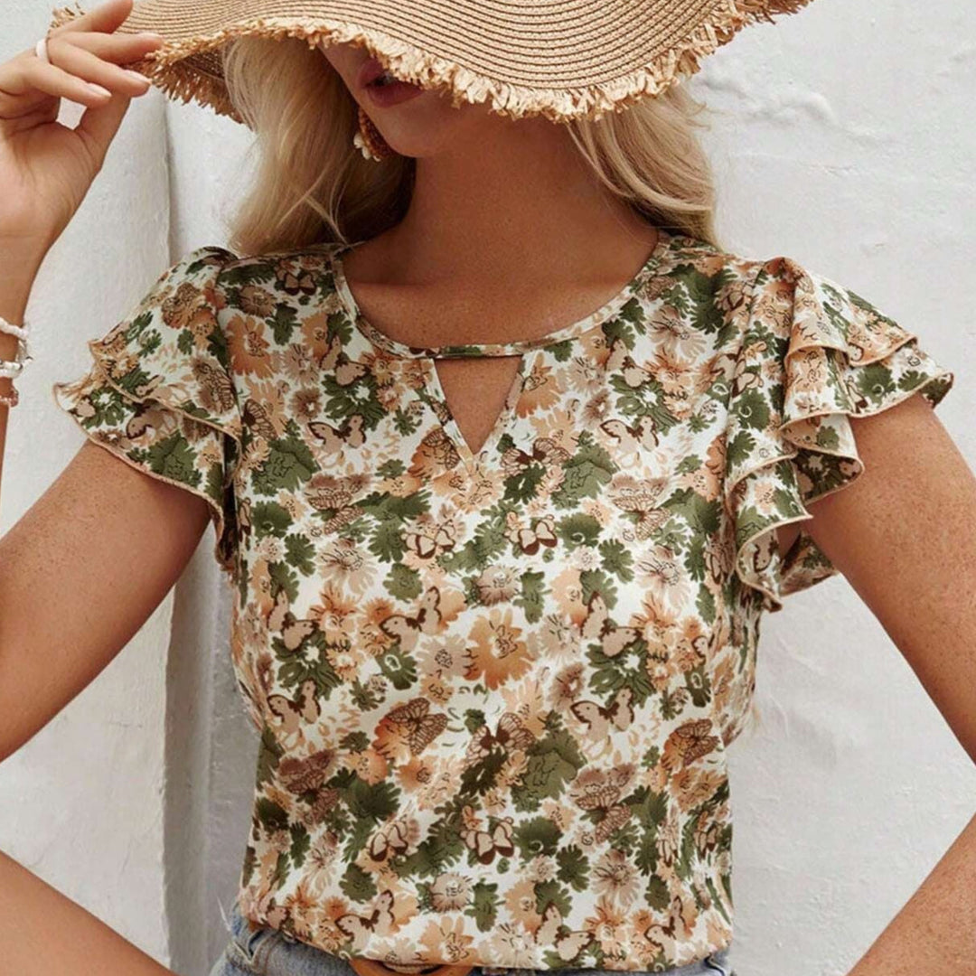 Haut femme imprimé floral avec volants délicats, parfait pour un style décontracté chic estival.