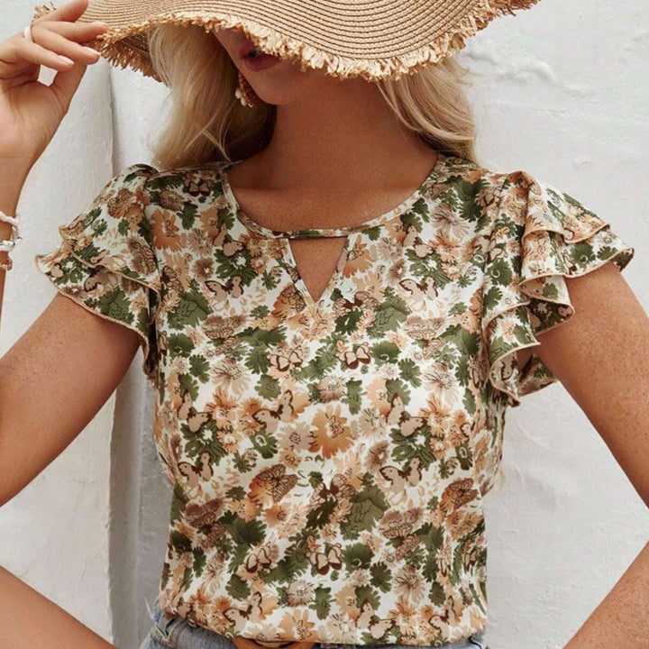Haut femme imprimé floral avec volants délicats, parfait pour un style décontracté chic estival.