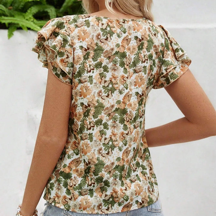 Blouse femme élégante, motif floral estival, dotée de jolis volants, très tendance.
