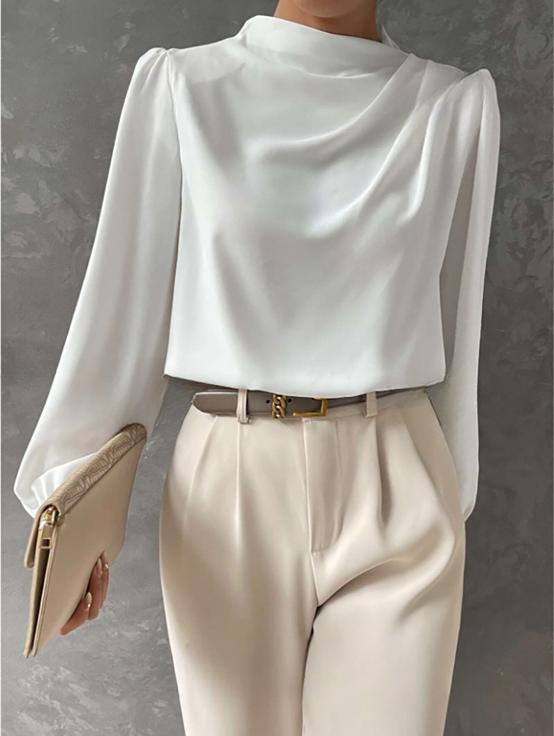 Chemisier femme polyvalent à col montant, manches longues. Style élégant pour toutes occasions, du bureau aux sorties.