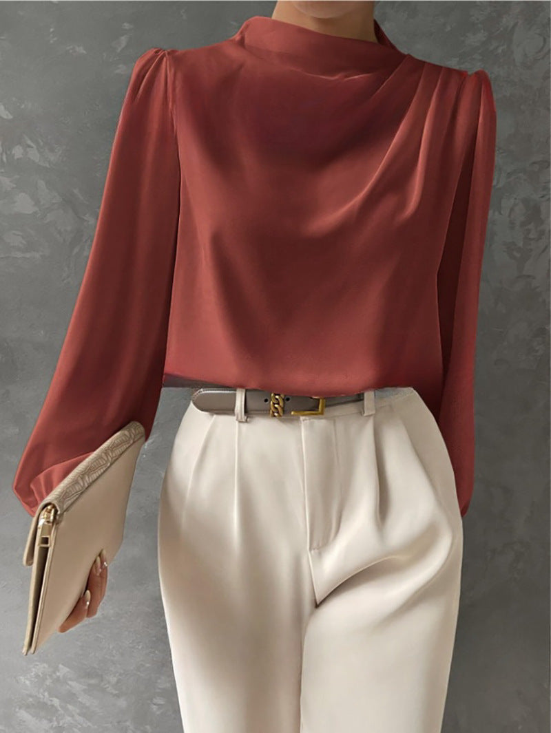 Blouse élégante femme couleur corail à col montant, manches longues. Idéale pour une touche de couleur raffinée en mode.