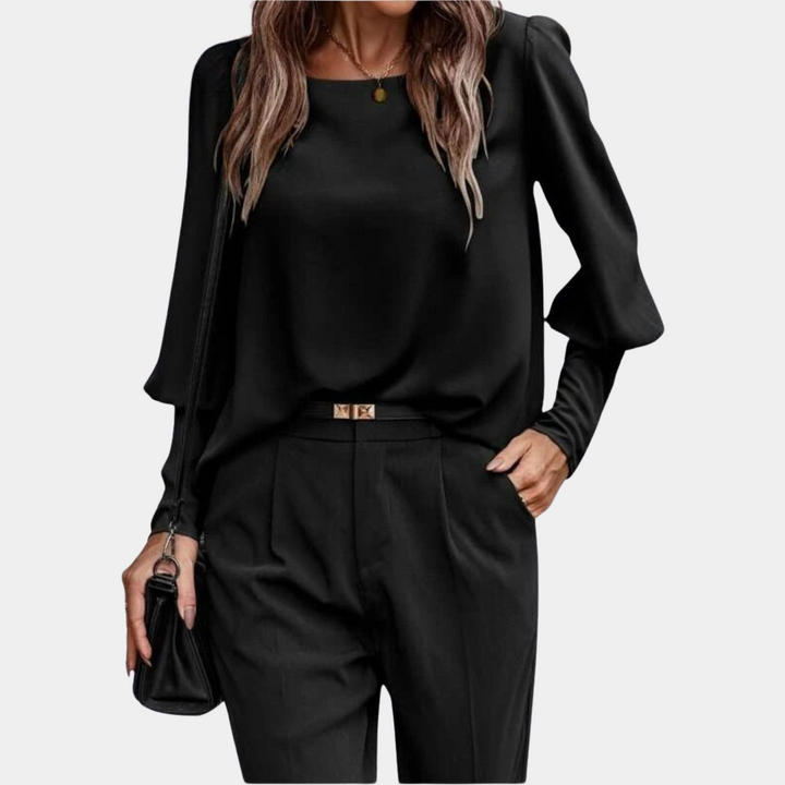 Blouse femme chic à manches ballon, disponible en plusieurs couleurs, idéale pour tenue bureau ou soirée.