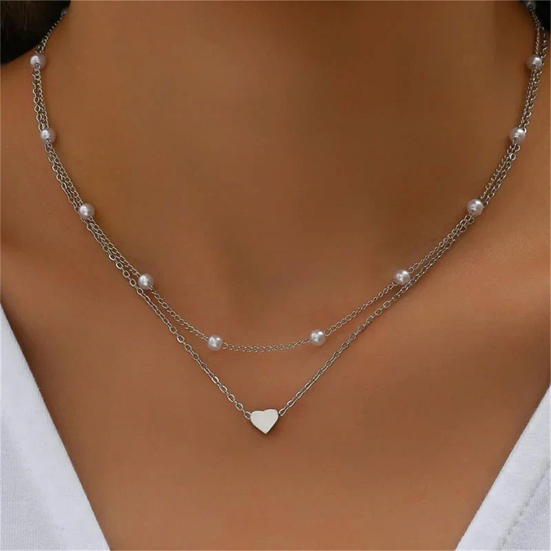 Collier multirangs 3 couches argent, pendentif cœur pour femme. Bijou délicat et chic.